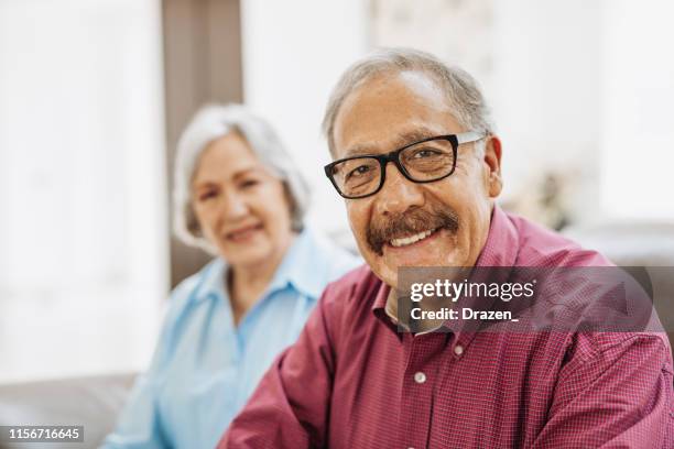 happiness in golden age - latino seniors living joyful life after year 65. - 70 year male stock pictures, royalty-free photos & images