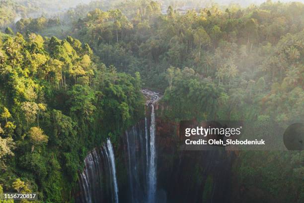 scenic aerial view of tumpak sewu waterfall on java - indonesia stock pictures, royalty-free photos & images