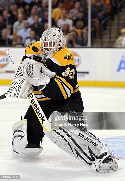 Tim Thomas of the Boston Bruins makes a save against the Vancouver Canucks during Game Four of the 2011 NHL Stanley Cup Final at TD Garden on June 8,...