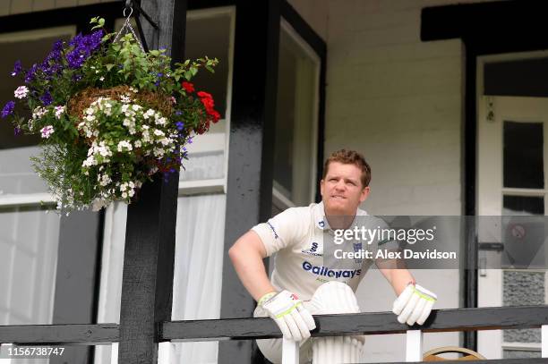 Sussex captain Ben Brown looks to the skys during a rain delay during Day One of the Specsavers County Championship Division Two match between...