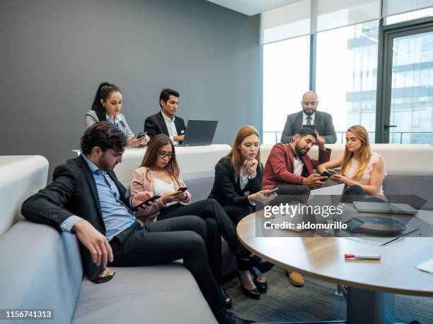 bored professionals using technological devices - boring meeting stock pictures, royalty-free photos & images