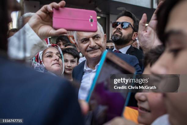 Istanbul mayoral candidate Binali Yildirim of the ruling Justice and Development Party meets with supporters during a campaign street stop on June...