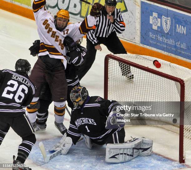 Gophers vs. Mankato State University Hockey. Minnesota's Seth Ambroz celebrating after slipping the puck past Mankato goalie Austin Lee for a first...