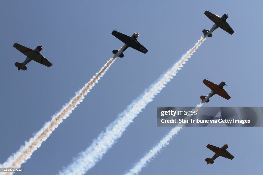 Military T-6 trainers did multiple fly-overs of the Anoka County Airport during the Discover Aviation Days on 6/2/12. The event goes through Sunday and features warbird fly-overs, aviation displays of experimental, homebuild, civil, corporate, military a