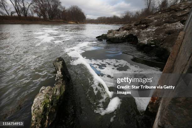 Water flows into the Minnesota River from a pipe connected to the Blue Lake treatment plant in Shakopee, MN, Monday Nov.12,2012. Phosphorus, the...