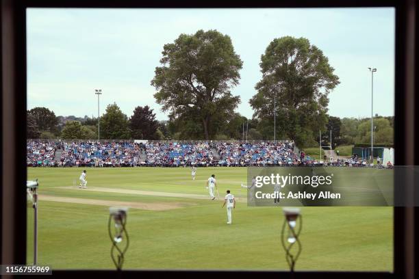 General view of play from within the York Cricket Club pavilion during the Specsavers County Championship Division one match between Yorkshire and...