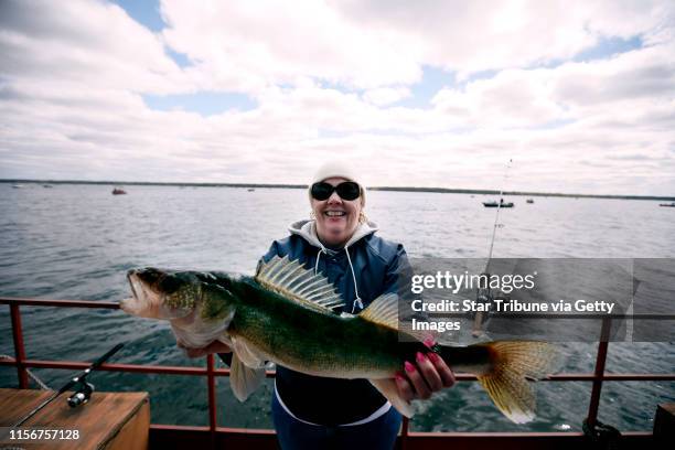 Winnie Zahradka posed with her 25 inch walleye that she caught on the Minnesota fishing opener at Lake Mille Lacs Saturday May 9, 2015 Malmo, MN.]...