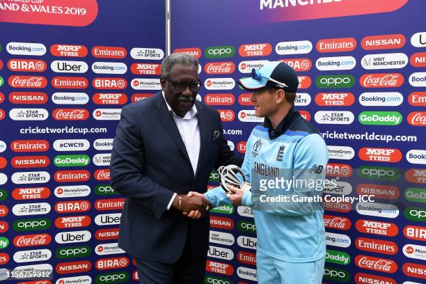 Former West Indies Cricketer Clive Lloyd presents Eoin Morgan of England with the Man of the match award during the Group Stage match of the ICC...