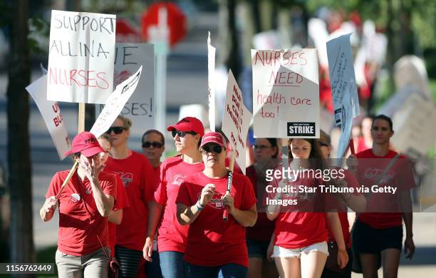 Thousands of nurses walked around Abbott Northwestern on the first day of the strike Sunday June 19, 2016 in Minneapolis, MN.] Day One in the Allina...