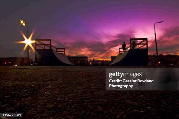 skateboard ramp in moscow at sunset - ハーフパイプ ストックフォトと画像