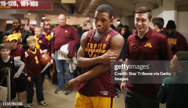 Gopher fans waited for freshman point guard Isaiah Washington to sign autographs during the University of Minnesota Maroon and Gold Scrimmage at...