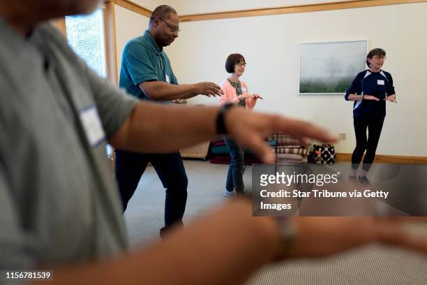 Greg Resendez left, Keith Washington, Paula Haraldson, and Carol Purcell worked on Tai Chi moves at Pathways, a healing center Wednesday September...