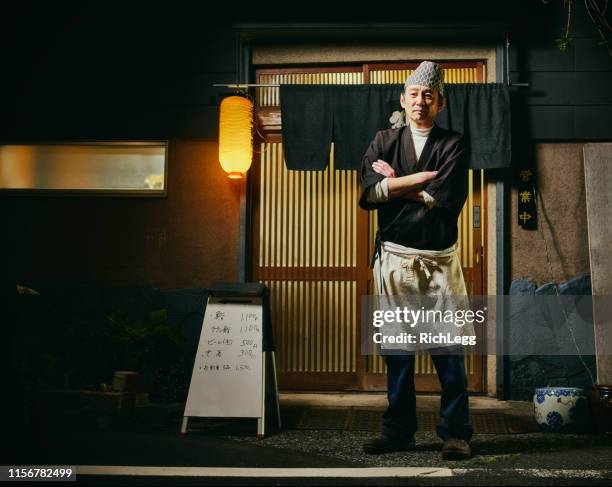 japanese sushi chef portrait at night - sushi chef stock pictures, royalty-free photos & images