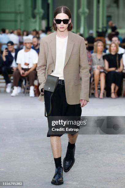 Model walks the runway at the Ami Alexandre Mattiussi fashion show at Grand Palais during Paris Men's Fashion Week Spring/Summer 2020 on June 18,...