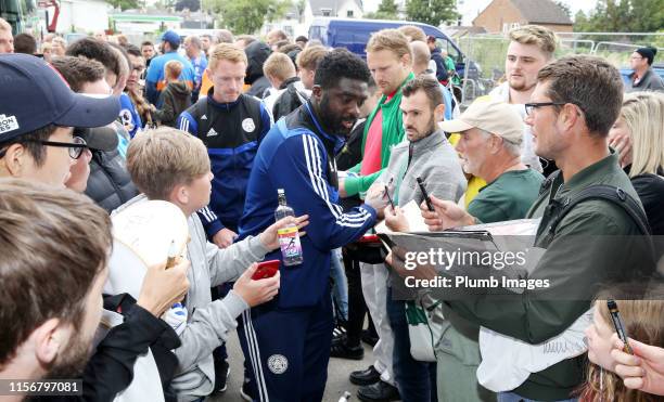 Kolo Toure Leicester City first team coach signs autographs as he arrives at Jonny-Rocks Stadium ahead of the Pre-Season Friendly match between...