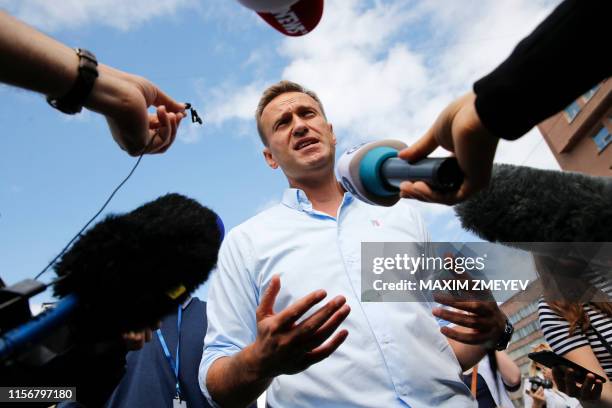 Russian opposition leader Alexei Navalny speaks with journalists during a rally to support opposition and independent candidates after authorities...