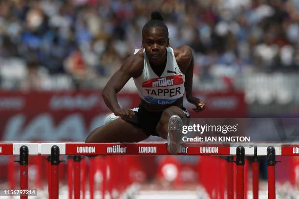 Jamaica's Megan Tapper competes in the Women's 100m Hurdles Heat A event during the the IAAF Diamond League Anniversary Games athletics meeting at...