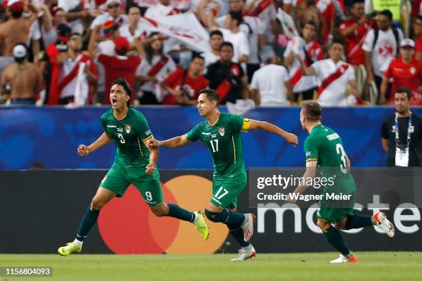 Marcelo Martins of Bolivia celebrates with teammate Marvin Bejarano after scoring the first goal of his team via penalty during the Copa America...