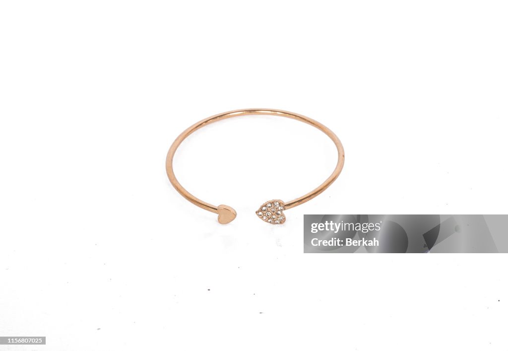 Gold bracelets for children with white backgrounds