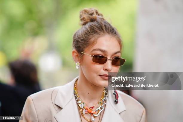 Gigi Hadid wears sunglasses, earrings, necklaces, outside Heron Preston, during Paris Fashion Week - Menswear Spring/Summer 2020, on June 18, 2019 in...