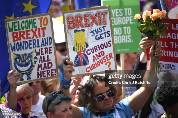 Protesters holding placards march to Parliament Square in Westminster during the "No To Boris, Yes To Europe" March on July 20, 2019 in London,...