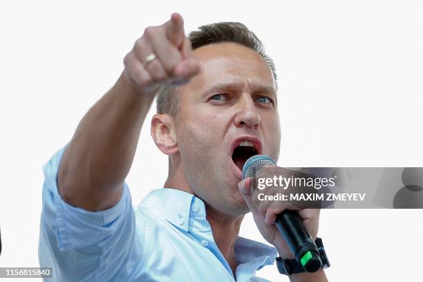 Russian opposition leader Alexei Navalny addresses demonstrators during a rally to support opposition and independent candidates after authorities...