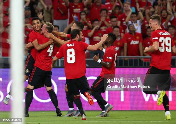 Mason Greenwood of Manchester United celebrates scoring a goal to make the score 1-0 with his team-mates during the 2019 International Champions Cup...