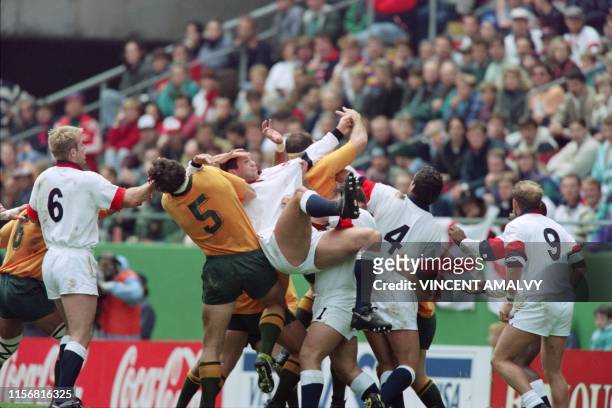 Picture taken on June 11, 1995 at cape Town showing English loosehead prop Jason Leonard upened in a lineout by Australian tighthead lock John Eales...