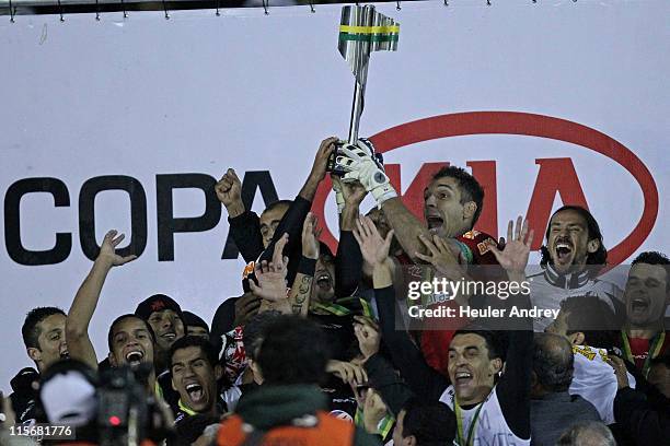 Players of Vasco celebrate title after defeating Coritiba in a final match as part of the Brazil Cup 2011 at Couto Pereira Stadium on June 8, 2011 in...
