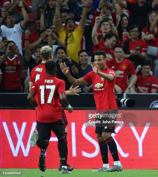 Mason Greenwood of Manchester United celebrates scoring a goal to make the score 1-0 during the 2019 International Champions Cup match between...