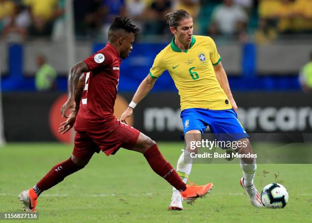 Filipe Luis of Brazil fights for the ball with Jhon Murillo of Venezuela during the Copa America Brazil 2019 group A match between Brazil and...