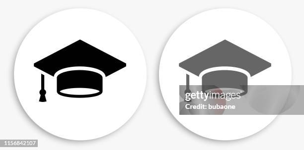 graduation cap black and white round icon - grad cap stock illustrations