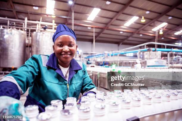 portrait of a female factory worker in africa - catering black uniform stock pictures, royalty-free photos & images