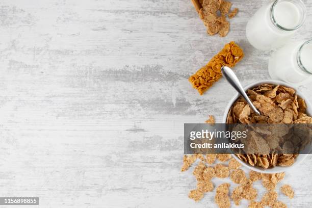 breakfast background with granola bar and corn flakes - corn flakes imagens e fotografias de stock
