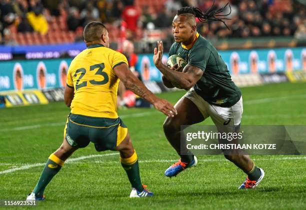 Australia's Kurtley Beale tries to block South Africa's S'busiso Nkosi during the 2019 Rugby Championship match, South Africa v Australia, at the...