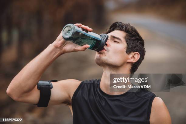 hydration is key - runner drinking water stock pictures, royalty-free photos & images