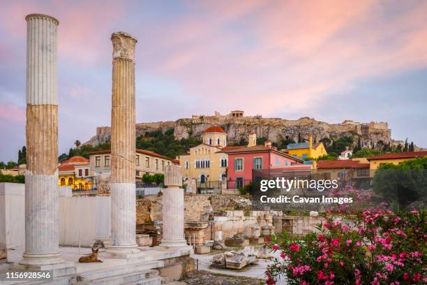 remains of hadrian's library and acropolis in the old town of athens, - plaka stock pictures, royalty-free photos & images