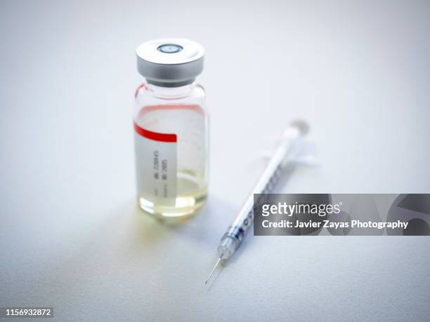 syringe and ampoule on white back ground - anabolic steroids stock pictures, royalty-free photos & images