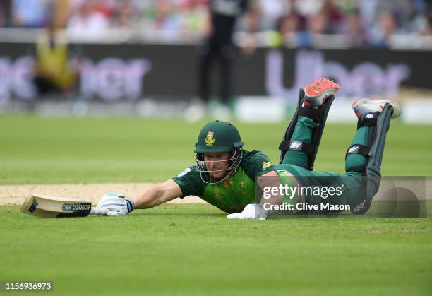 David Miller of South Africa dives to make his ground during the Group Stage match of the ICC Cricket World Cup 2019 between New Zealand and South...