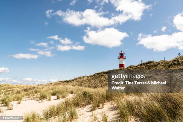 lighthouse on the beach of sylt. "ellenbogen" - sylt stock-fotos und bilder