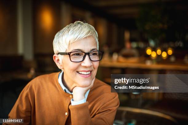 portrait of a smiling senior woman - dentures stock pictures, royalty-free photos & images