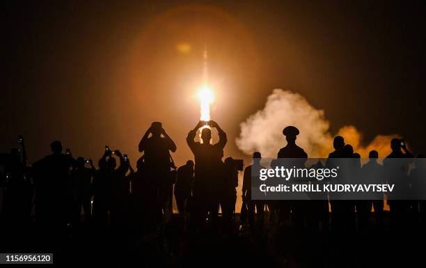 Russia's Soyuz MS-13 spacecraft carrying the members of the International Space Station expedition 60/61, NASA astronaut Andrew Morgan, Russian...