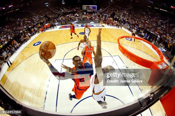 Jason Maxiell of 3s Company goes in for a layup over Josh Smith of Bivouac during the BIG 3 game at Sprint Center on July 20, 2019 in Kansas City,...