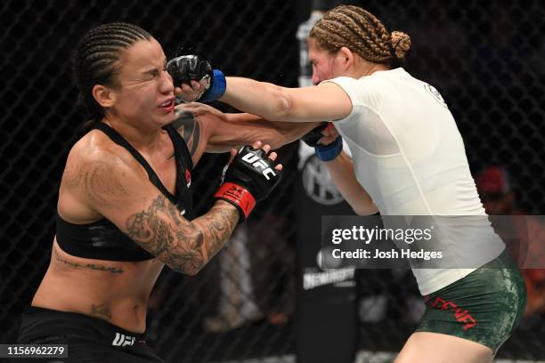 Irene Aldana of Mexico punches Raquel Pennington in their women's bantamweight bout during the UFC Fight Night event at AT&T Center on July 20, 2019...