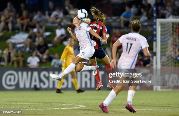 Houston Dash forward Rachel Daly heads a ball as Washington Spirit defender Amy Harrison defends during the National Womens Soccer League game...