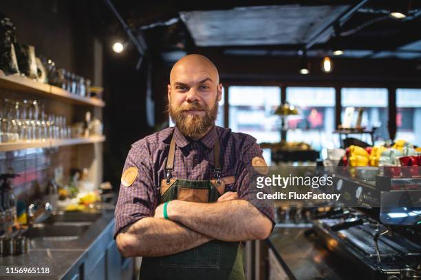 cool hipster man in his workplace - hipster barkeeper stock pictures, royalty-free photos & images