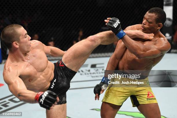 Alexander Hernandez kicks Francisco Trinaldo of Brazil in their lightweight bout during the UFC Fight Night event at AT&T Center on July 20, 2019 in...
