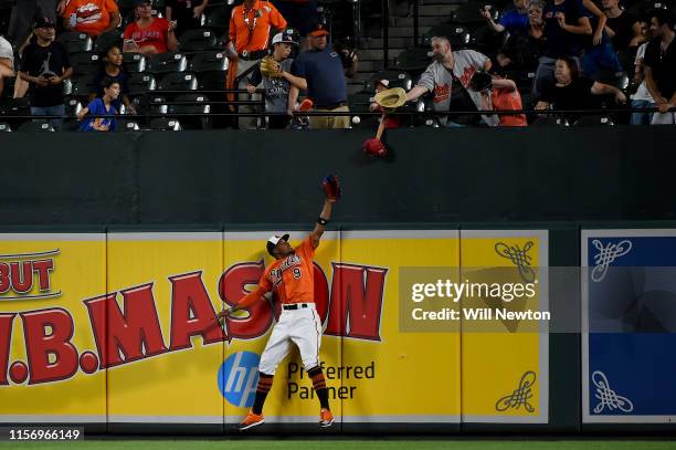 LBALTIMORE, MD Keon Broxton of the Baltimore Orioles can not make the catch of the home run hit by Sandy Leon of the Boston Red Sox during the ninth...