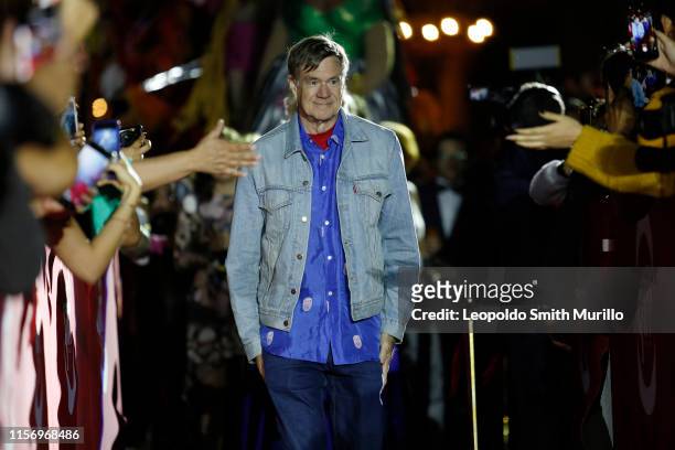 American film director Gus Van Sant greets fans and attendants before receiving the silver cross, as a tribute to his career, as part of the...