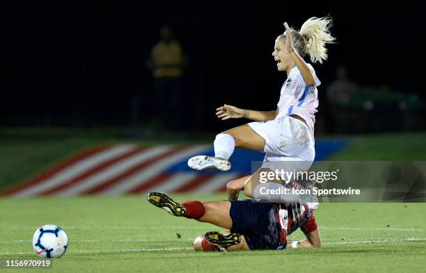 Houston Dash forward Rachel Daly is slide tackled by Washington Spirit defender Paige Nielsen in the last minute of the National Womens Soccer League...